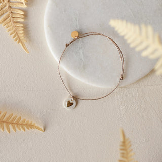 Bracelet coeur médaillon sur cordon chez Coton en Herbe Baubels